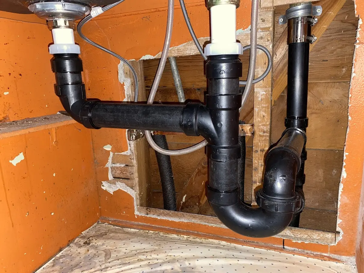 Professional Garbage Disposal Repair equipment and tools on the job in Orono